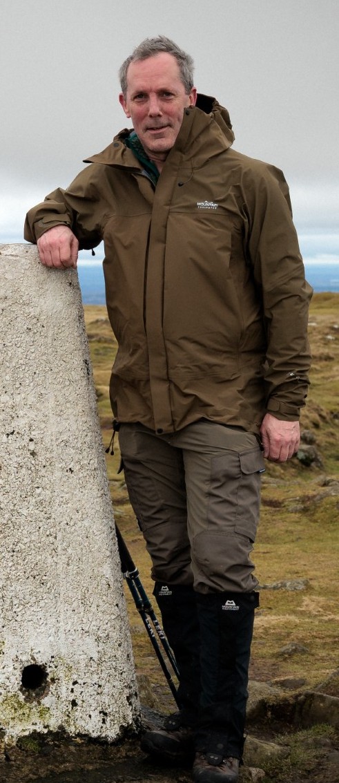 Ben Wise at the trig point, ready for the hills